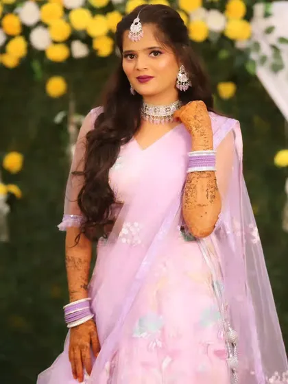 Another beautiful portrait of the bride, her hands framing her face to show off her mehndi.