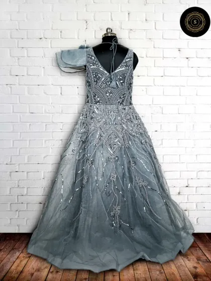 This grey-blue gown with intricate silver beadwork looks like it's straight out of a fairytale. The A-line silhouette is flattering for all body types.