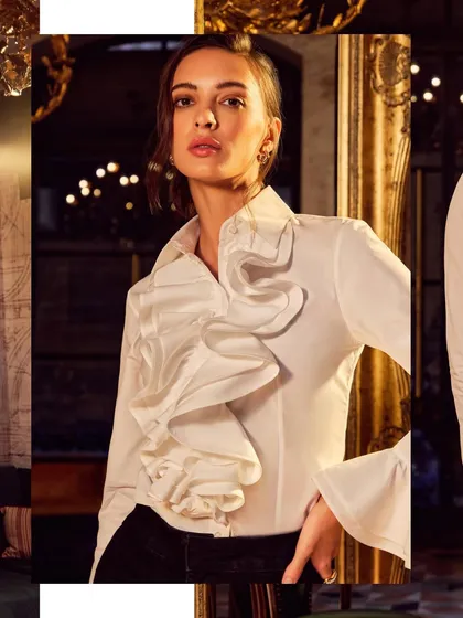 A sophisticated look for a formal wear brand. The lighting is designed to accentuate the rich textures of the ruffled shirt, set against an opulent, warm background for a classic feel.