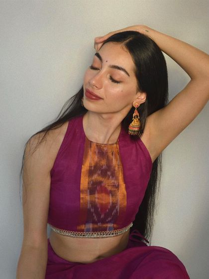 This shot features a contemporary ethnic look with a stylish halter neck blouse. It's an example of how I model fusion wear, blending traditional fabrics like Ikat with modern silhouettes.