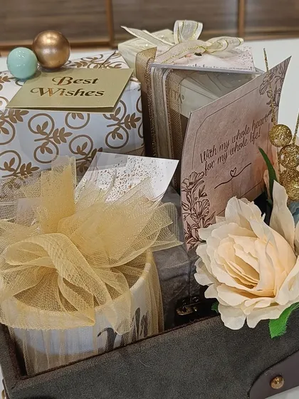 The full engagement hamper for the groom, presented in a stylish leather-finish tray. It includes a personalized mug, cards, and other thoughtfully chosen gifts.