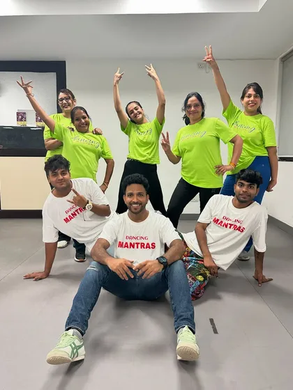 A fun, dynamic pose from the 'Sassy Shufflers' and their instructors. We're all about creating joyful memories.