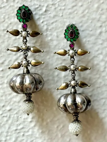 Can anything be more beautiful than pure silver Indian earrings? This pair features a unique tiered design with pearl drops, combining oxidised and polished silver for a striking look.