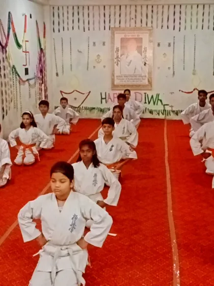 Students in seiza, the formal kneeling position, waiting for the test to begin. This posture builds discipline and patience.