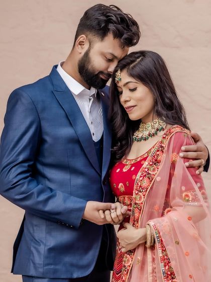 A romantic pre-wedding portrait. The makeup is soft and pretty, with a focus on rosy cheeks and a matching lip color.