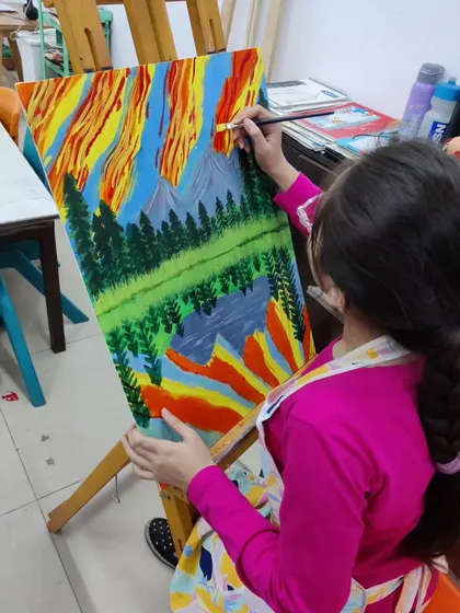 Follow a student's progress on a vibrant landscape painting, showing the development from a simple sketch to a fully colored and detailed scene.