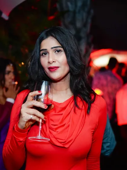 A guest enjoying a glass of wine at the Halloween Sundowner at JW Marriott, Bangalore. My events are about creating a complete, enjoyable experience.