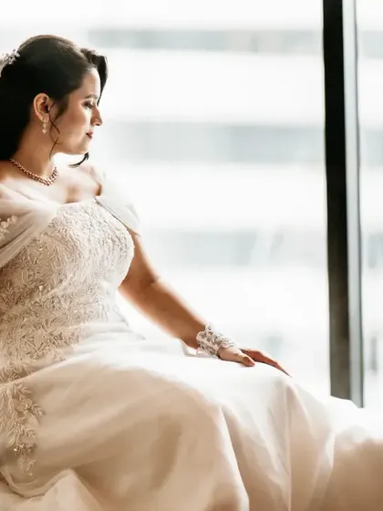 A beautiful bridal portrait by a large window, using the natural light to create a soft and elegant look.
