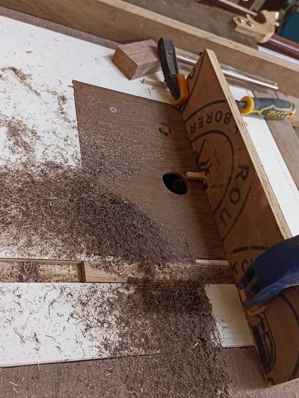 The process of cutting box joints on the router table. The jig ensures that the spacing of the fingers is perfect and consistent.