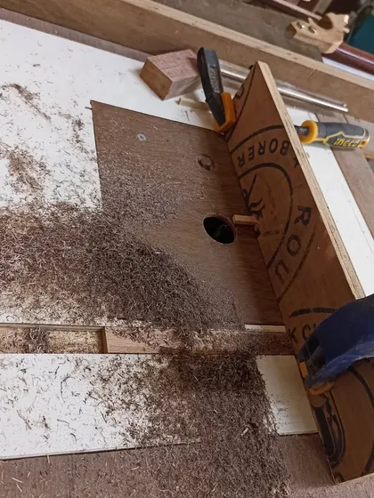 The process of cutting box joints on the router table. The jig ensures that the spacing of the fingers is perfect and consistent.