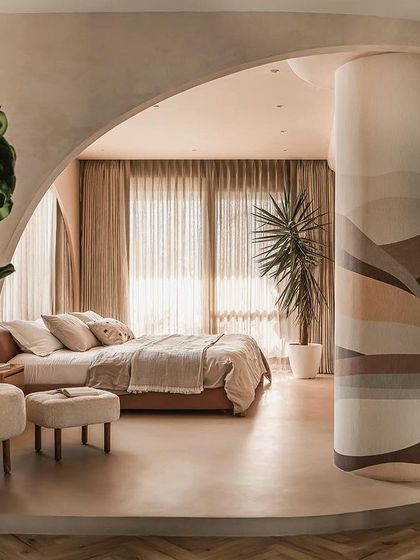 The master suite in the "Marshmallow" penthouse, where we combined two bedrooms to create a free-flowing, uninterrupted space defined by curved volumes and natural light.