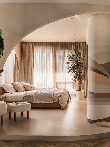 The master suite in the "Marshmallow" penthouse, where we combined two bedrooms to create a free-flowing, uninterrupted space defined by curved volumes and natural light.
