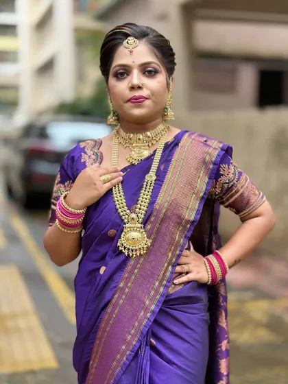 A confident pose from our model, showcasing the complete makeup, hair, and styling taught in our classes.