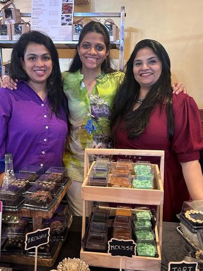 Posing with friends and supporters at my pop-up. The sense of community and encouragement I receive is what keeps me motivated on this journey.