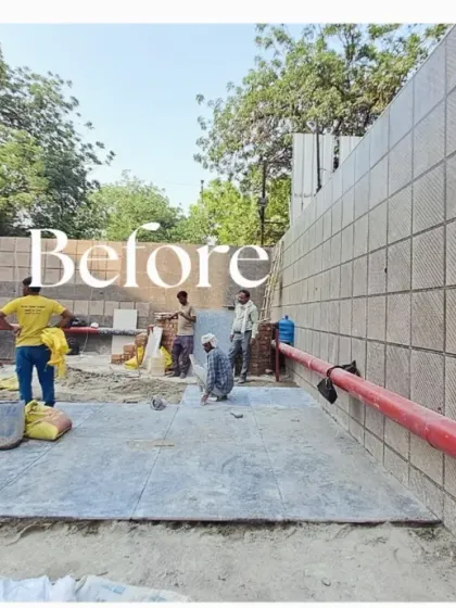 Before: This wide shot shows the full scale of the blank wall and construction area before our work began.