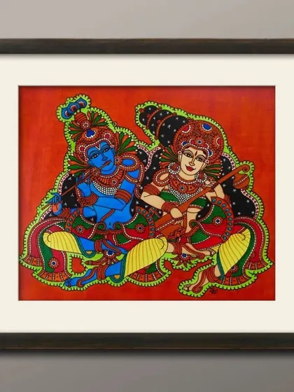 A framed painting of Radheshyam, showing Radha and Krishna with musical instruments. This 18x16 inch piece captures a moment of divine harmony and is available to bring that same peace into your home.