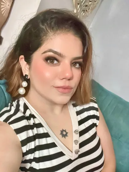 A selfie showing off the makeup of the day. A simple striped top with a touch of glam is my kind of vibe.