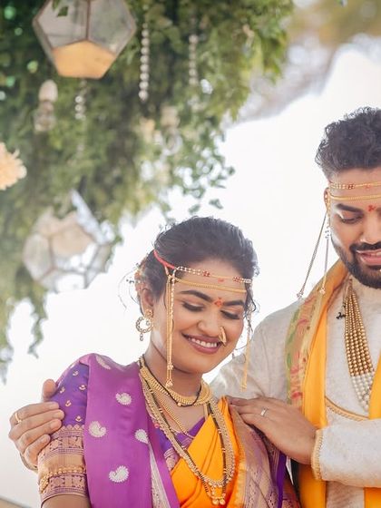 A beautiful, shy smile from the bride as her groom looks on. These candid moments are priceless.