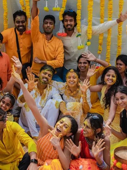 Another angle of a lively group photo at a Haldi ceremony. We make sure to get shots that include all the important people celebrating with you.