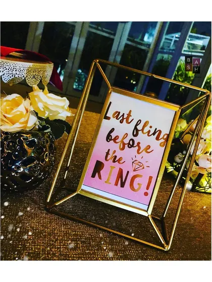 Cheeky and fun signage is a must for any bachelorette party. This 'Last fling before the RING!' sign in a modern gold frame is one of the many small details I provide to complete the theme.