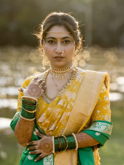 A powerful portrait of the bride in the golden hour light, her gaze confident and serene.