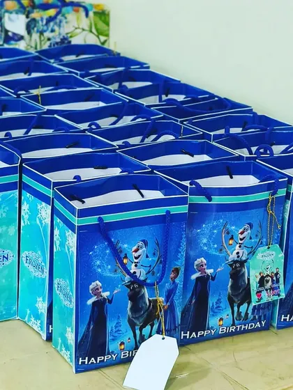Themed return gifts are the perfect way to thank your guests. Here are Frozen-themed goodie bags, ready to be filled with treats for the little ones.