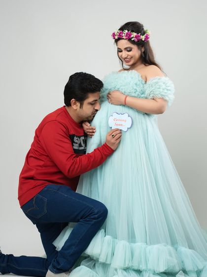 A father's love begins long before the first hello. This touching moment shows a dad-to-be whispering to the bump, a beautiful memory captured forever in my studio.