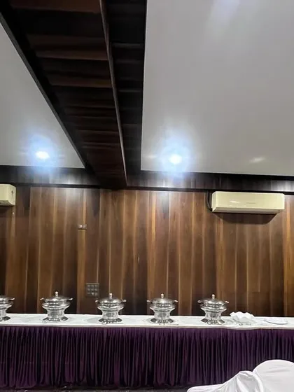For a clean and classic look, I offer this streamlined buffet arrangement, perfect for corporate meetings and seminars. My banner is also visible, showing my branding at the event.