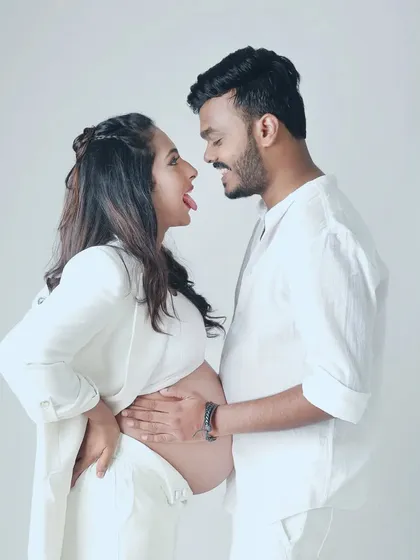 Who says maternity shoots can't be fun? A silly, playful moment between the couple brings out their unique personalities and the joy they share.