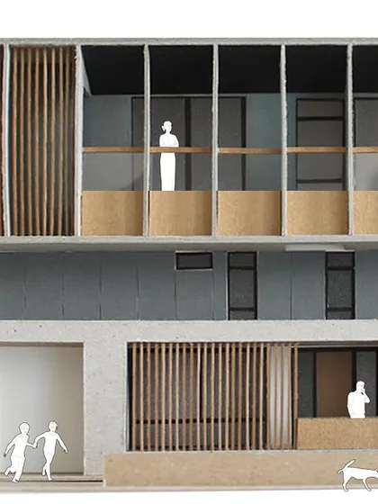 A physical model of a residential facade design, paired with its corresponding architectural section drawing. This illustrates our meticulous design process, where we explore form, proportion, and human scale with precision from the earliest stages.