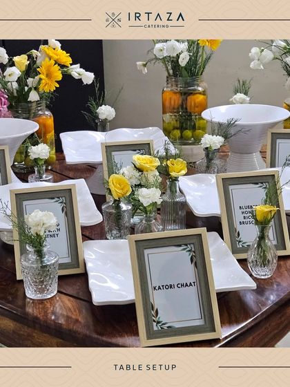 A bright and cheerful table setup with fresh yellow and white flowers, ideal for a brunch, baby shower, or daytime celebration.