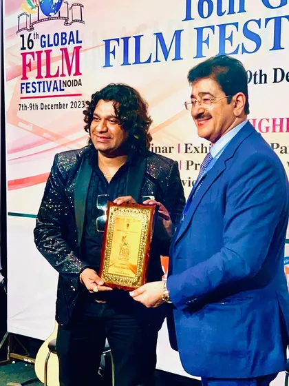 A moment of immense pride receiving a memento from the honorable Dr. Sandeep Marwah Ji at the 16th Global Film Festival.
