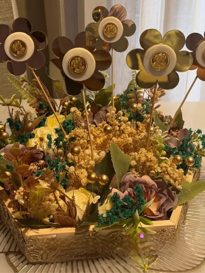 This hamper features decorative floral sticks in a beautiful basket, creating a unique and lasting gift that doubles as home decor. It's perfect for housewarmings or as a corporate gift.