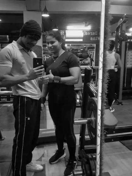A photo with a fellow champion in the gym. We motivate each other to keep pushing and reaching for new goals.