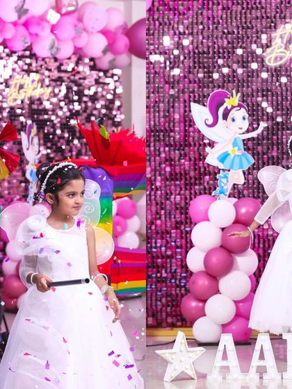 A thrilling 'Spiderman' themed birthday party, with red and blue decor, spiderweb props, and a cityscape backdrop, ready for web-slinging action.