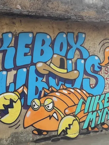 A fun, character-driven graffiti piece for "Jukebox Cowboys" by artist Mynt One. The artwork features a cowboy hat-wearing scorpion, showcasing a more illustrative and cartoonish style.