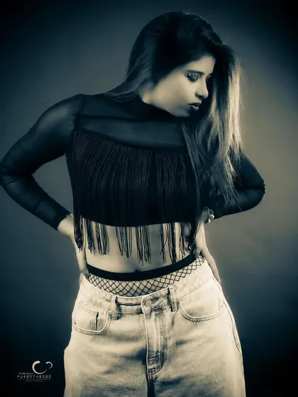 The same outfit shot in a moody, low-key black and white style. This version emphasizes texture and form, creating a completely different, more introspective vibe.