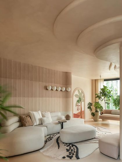 The color palette for this home was inspired by a triple chocolate mousse. We used layers of rich mocha, caramel, and ivory tones on the walls and microcement flooring to wrap the home in a comforting, tactile calm.