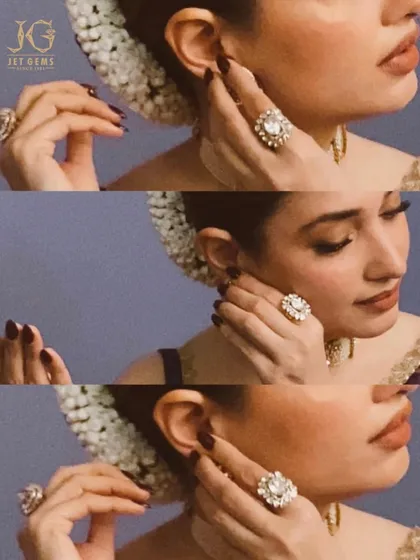 A detailed look at the magnificent floral statement ring worn by Tamannaah Bhatia. The piece is designed with a large central diamond surrounded by petals of smaller stones.
