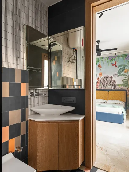 This shot shows the connection between the kid's bedroom and its attached washroom. The design continuity creates a cohesive and spacious feel.