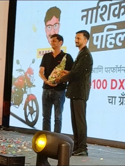 Being felicitated on stage after the successful performance for the Honda bike launch. I am always grateful for the client's appreciation.
