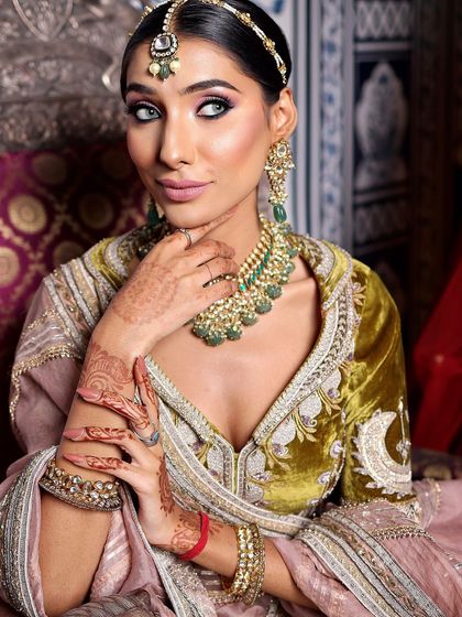 This bride's eyes are the star of the show. The use of colored contact lenses and dramatic eye makeup creates a captivating and modern bridal look.