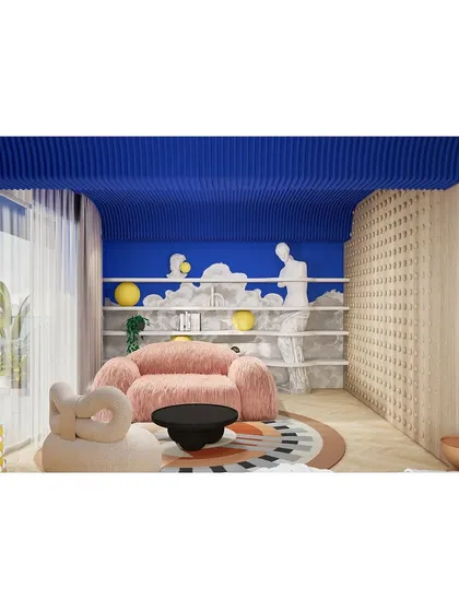This surreal lounge area features a fluffy pink sofa set against a vibrant blue wall with a cloud-like bookshelf. It's a space designed for dreaming.