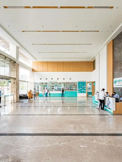 The spacious, light-filled lobby at Sarvesh Health City in Hisar is designed to handle high footfall while maintaining a serene atmosphere. The polished marble floors and high ceilings contribute to a feeling of openness and calm.