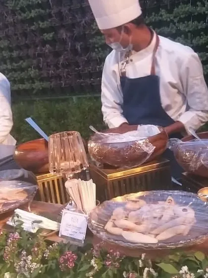 A glimpse of our 'Delli Chaat Street' live station, where our chefs prepare a variety of classic Indian street food snacks. This setup is perfect for adding a fun and traditional touch to any party.