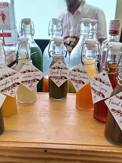 My collection of house-made syrups. I create unique flavors like Spiced Coffee, Pumpkin Purée, and Fennel Orgeat, all presented in labeled bottles for crafting truly bespoke and artisanal cocktails.