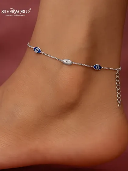 Protect your energy with our stylish Evil Eye anklet. This delicate 925 silver chain features classic blue enamel evil eye charms, designed to be a subtle yet powerful talisman against negativity.