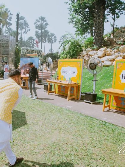 Bringing the fun of a 'mela' to the wedding. We set up classic fairground games like 'Ring Toss' and 'Hit the Cans' for this Rajasthani-themed Haldi.
