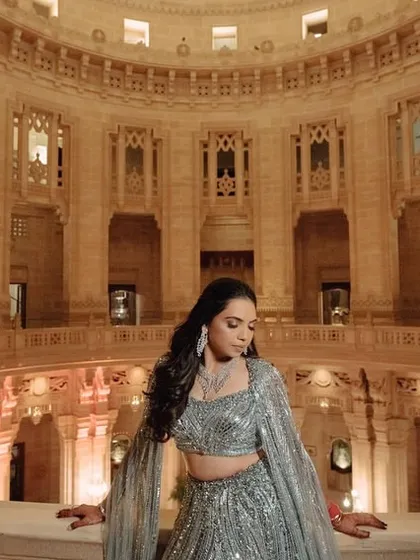 For Nikita's sangeet at Mehrangarh Fort, we went for something unexpected. This powder-blue fishtail lehenga by Gaurav Gupta was a modern, dramatic choice that stood out beautifully against the royal backdrop.