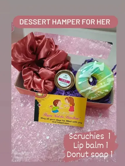 A dessert hamper for her, this Rakhi gift combines a handmade donut soap with a lip balm and satin scrunchies.